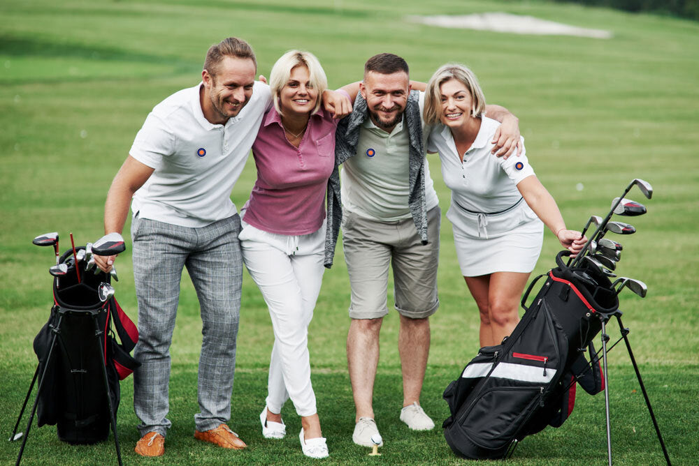 Group smiling after playing a round of golf