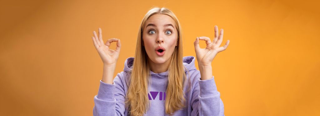 Young blonde worked with logo hoodie.